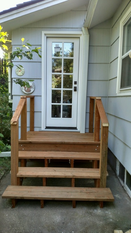New backdoor and steps in place of a window by West Coast Restoration