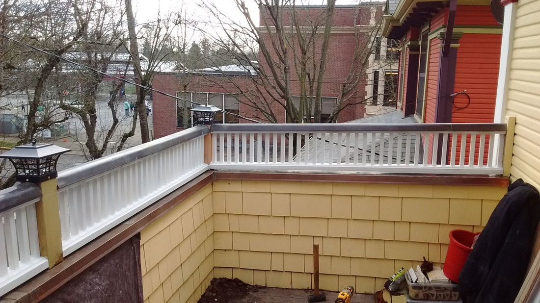 Railing rebuilt for upstairs deck in old Portland home by West Coast Restoration